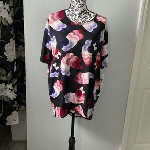 Black shirt with different colored Mini and Mickey  silhouette shapes .